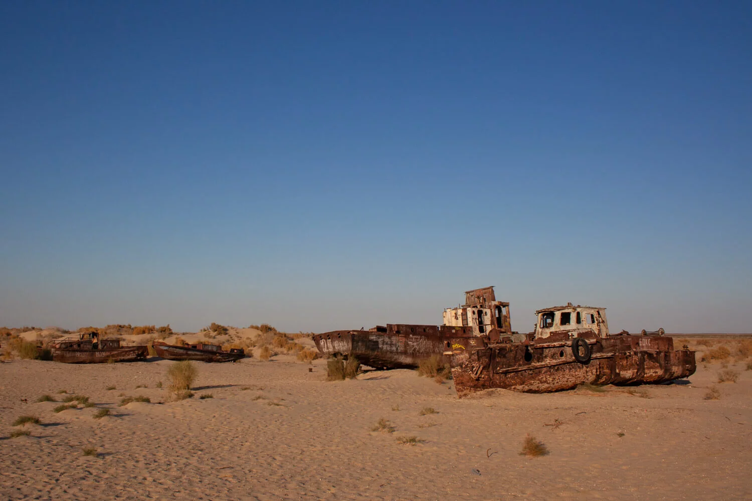 Uzbekistan: Skeletons of fishing boats, near the town of Muynaq, Aral Lake
